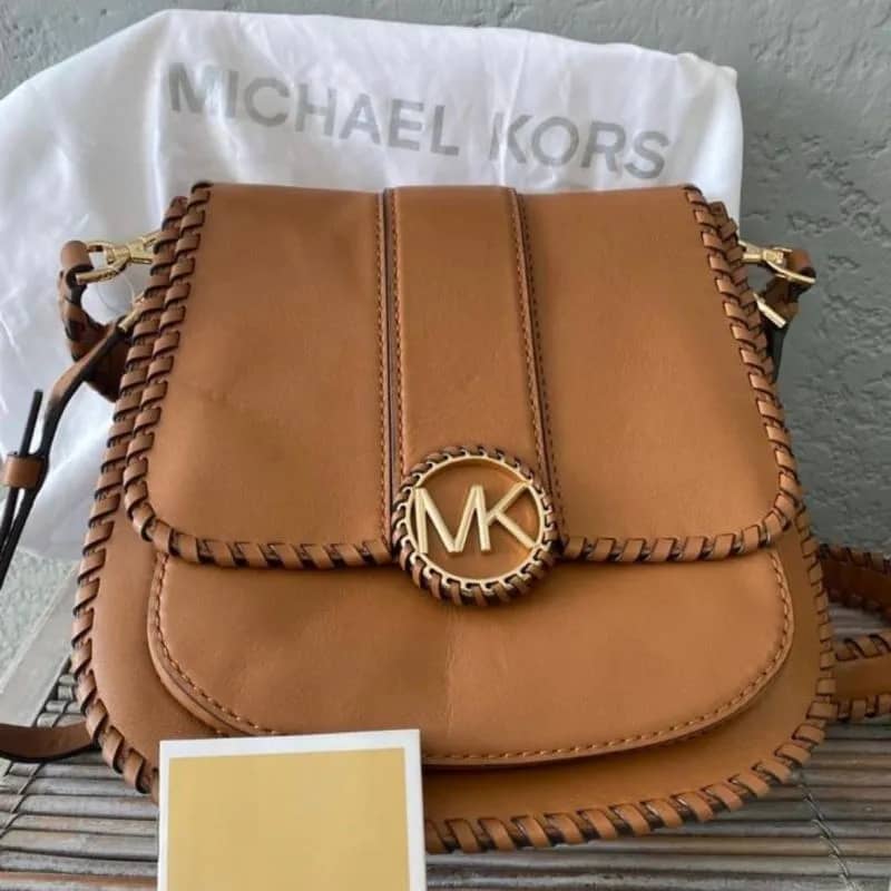 Imagem da campanha Bolsa MK Couro legítimo original - Perfeita e atemporal ( peça nova )